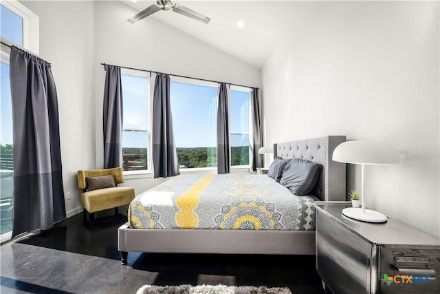 bedroom featuring hardwood / wood-style flooring, vaulted ceiling, and ceiling fan