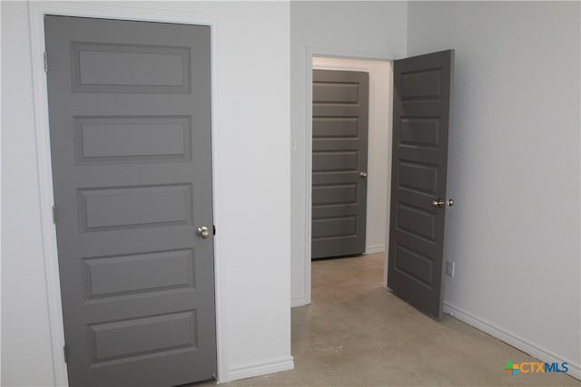 hallway featuring light carpet