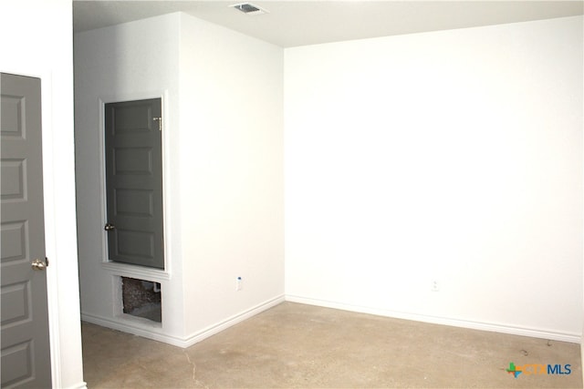 unfurnished room featuring light colored carpet