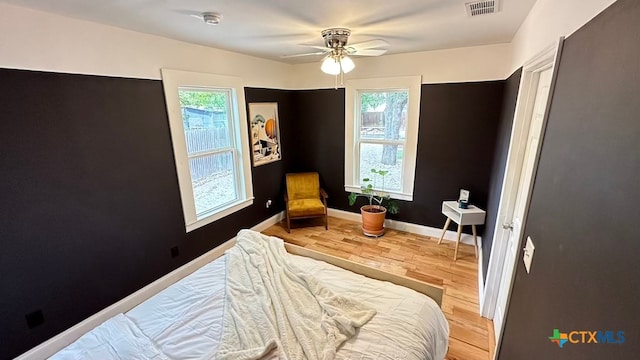 bedroom featuring wood-type flooring and ceiling fan