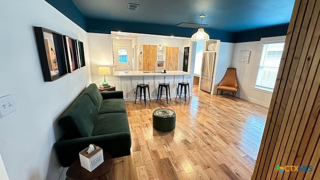 living room with light hardwood / wood-style floors