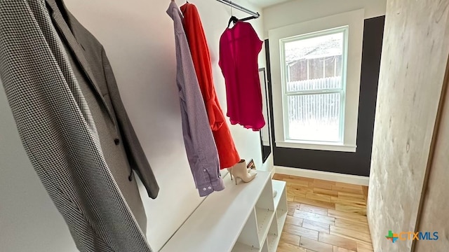 mudroom with light hardwood / wood-style floors