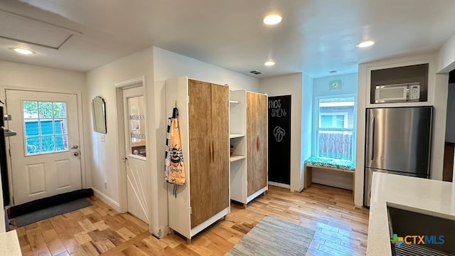 doorway with light hardwood / wood-style floors