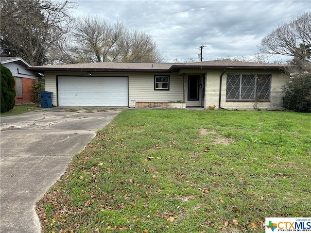 ranch-style house with a garage and a front yard