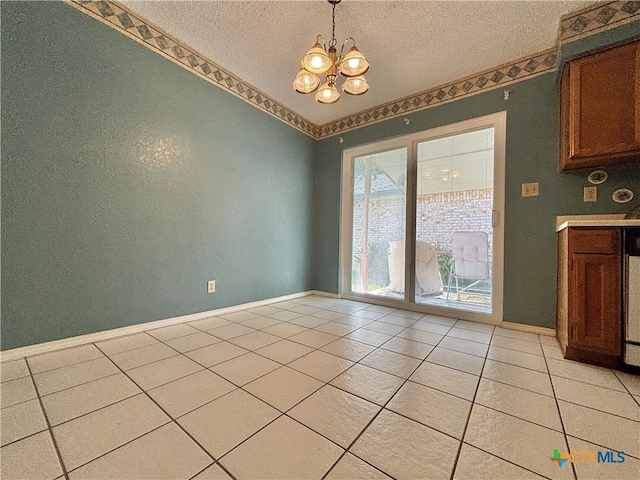 unfurnished dining area with light tile patterned floors, a textured ceiling, and an inviting chandelier