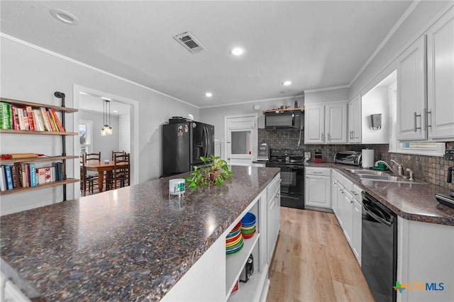 kitchen featuring black appliances, white cabinetry, open shelves, and a sink