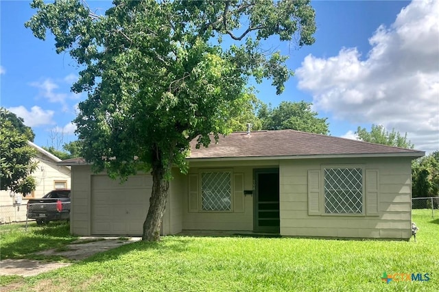 708 E Loma Vista Ave, Victoria, TX 77901 - view of front of house featuring an attached garage, a shingled roof, and driveway