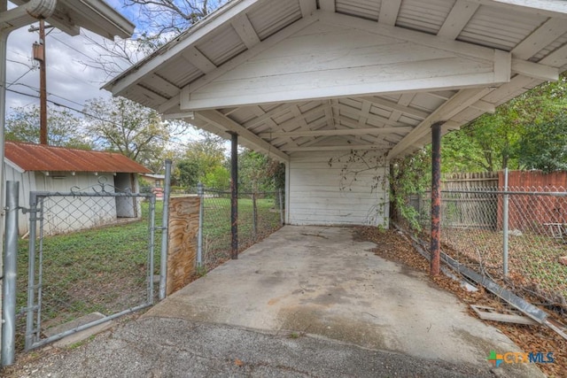 view of parking / parking lot featuring a carport