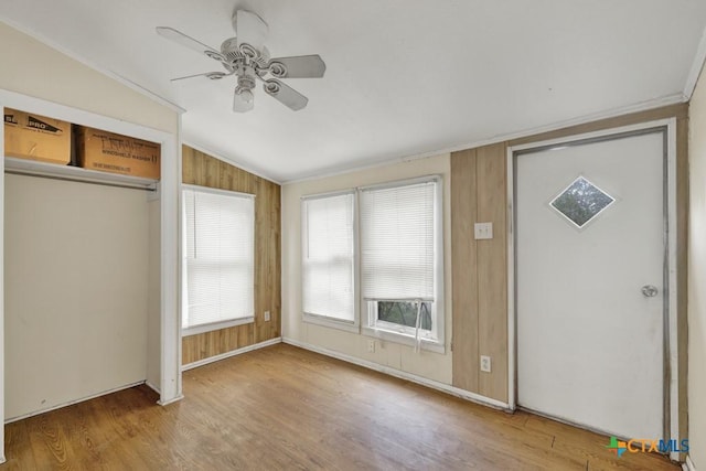 entrance foyer featuring ceiling fan, light hardwood / wood-style flooring, and vaulted ceiling