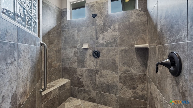 bathroom featuring tiled shower