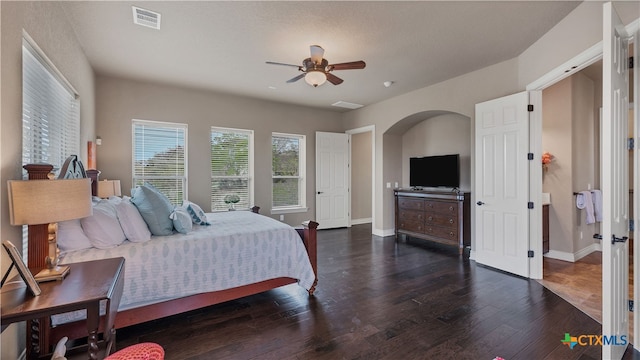 bedroom with ceiling fan and dark hardwood / wood-style flooring