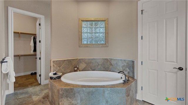 bathroom with tiled tub