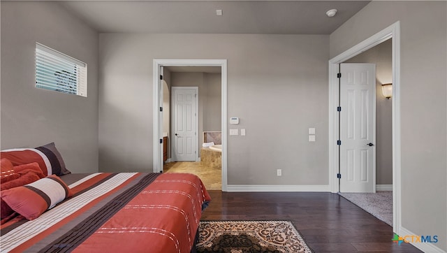 bedroom featuring dark wood-type flooring