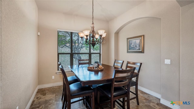 dining space featuring a chandelier