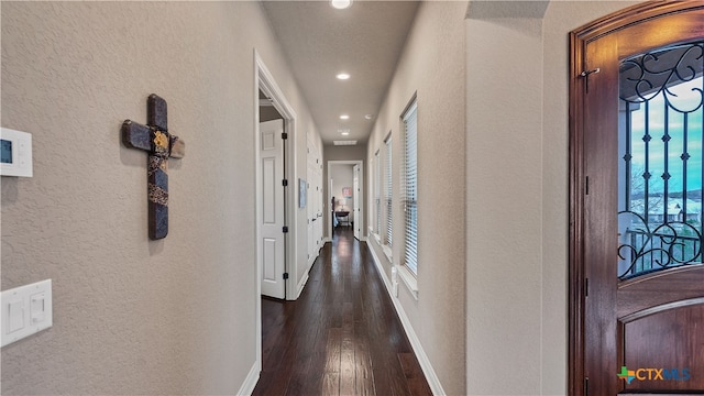 hall with dark hardwood / wood-style floors