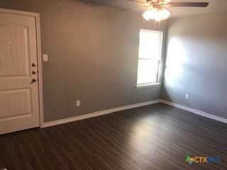 1818 Castroville Trl, Copperas Cove, TX 76522 - unfurnished room featuring ceiling fan, baseboards, and dark wood-style floors