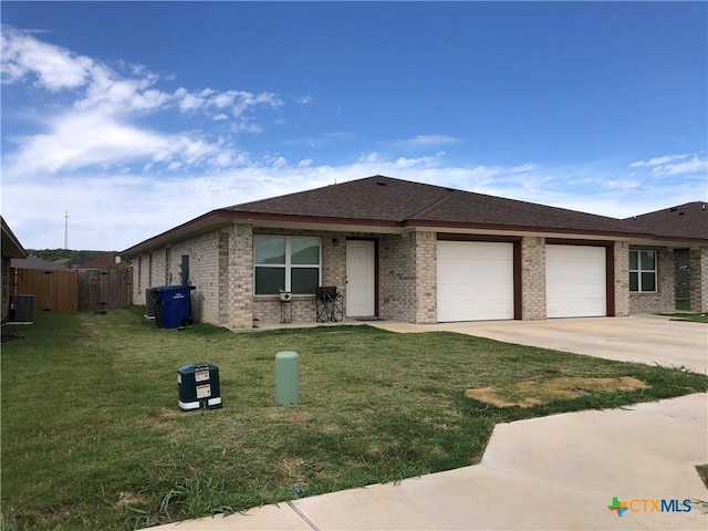 1818 Castroville Trl, Copperas Cove, TX 76522 - view of front facade featuring an attached garage, brick siding, concrete driveway, and roof with shingles