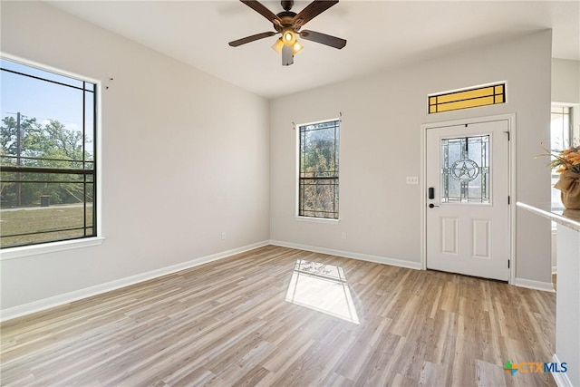 180 Jim Bowie Dr, Paige, TX 78659 - foyer with healthy amount of natural light, light wood-type flooring, and a ceiling fan