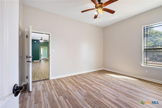 180 Jim Bowie Dr, Paige, TX 78659 - unfurnished room featuring ceiling fan, light wood-style floors, and baseboards