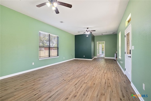 180 Jim Bowie Dr, Paige, TX 78659 - spare room with ceiling fan, wood finished floors, and baseboards