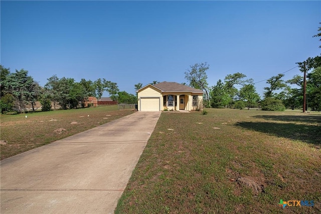 180 Jim Bowie Dr, Paige, TX 78659 - single story home with driveway, a front lawn, and a garage
