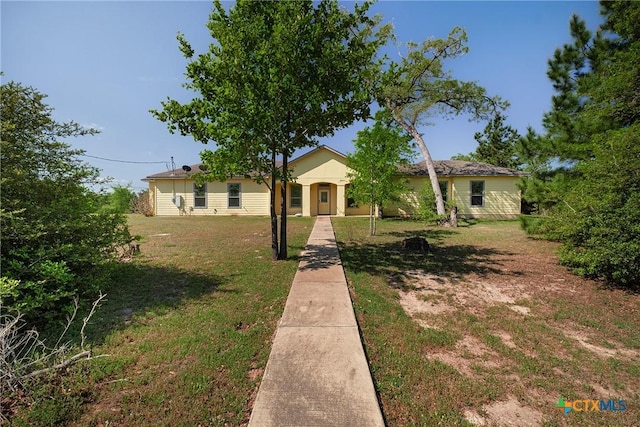 180 Jim Bowie Dr, Paige, TX 78659 - ranch-style home with a front yard