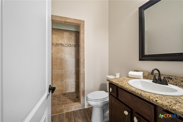 180 Jim Bowie Dr, Paige, TX 78659 - full bath with a shower stall, vanity, toilet, and wood finished floors
