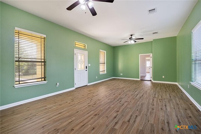 180 Jim Bowie Dr, Paige, TX 78659 - spare room with ceiling fan, wood finished floors, and baseboards