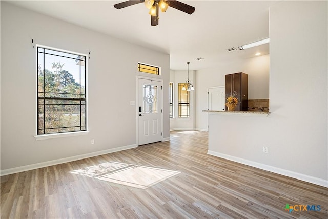 180 Jim Bowie Dr, Paige, TX 78659 - entrance foyer featuring light wood-style flooring, ceiling fan, and baseboards