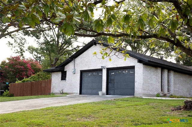 garage with a yard