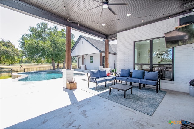 exterior space with ceiling fan, an outdoor living space, and a patio area