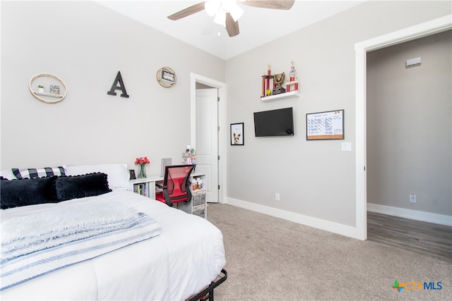 bedroom with ceiling fan and carpet floors