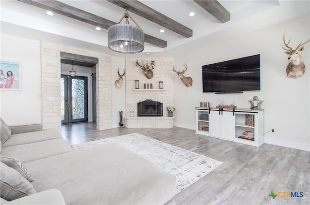 living room with wood-type flooring and beam ceiling