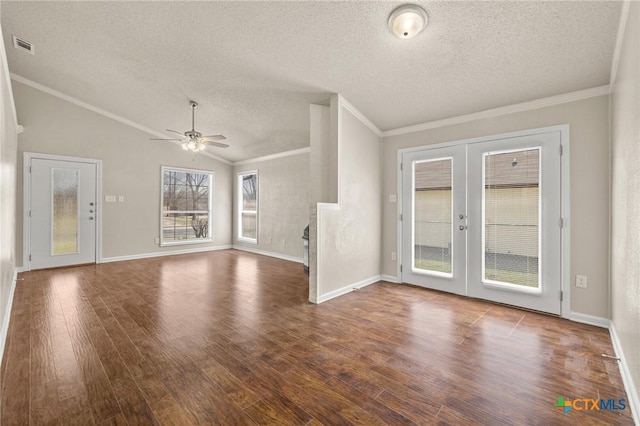 unfurnished living room featuring wood finished floors, lofted ceiling, ceiling fan, french doors, and crown molding