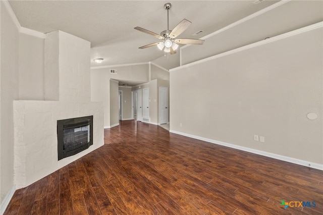 unfurnished living room featuring wood finished floors, a ceiling fan, visible vents, a multi sided fireplace, and vaulted ceiling