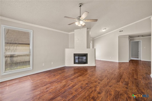 unfurnished living room with visible vents, crown molding, ceiling fan, and wood finished floors