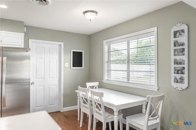 401 Hampshire St, Victoria, TX 77904 - dining area featuring dark wood-type flooring and baseboards