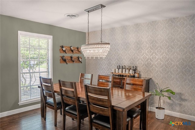 401 Hampshire St, Victoria, TX 77904 - dining space with a chandelier, wood finished floors, and wallpapered walls