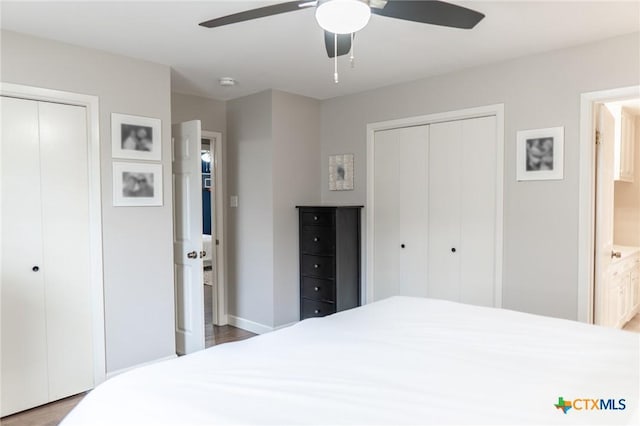 401 Hampshire St, Victoria, TX 77904 - bedroom featuring wood finished floors, two closets, ensuite bathroom, and a ceiling fan