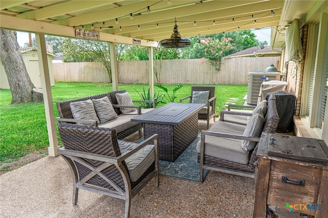 401 Hampshire St, Victoria, TX 77904 - fenced backyard with an outdoor hangout area and a patio