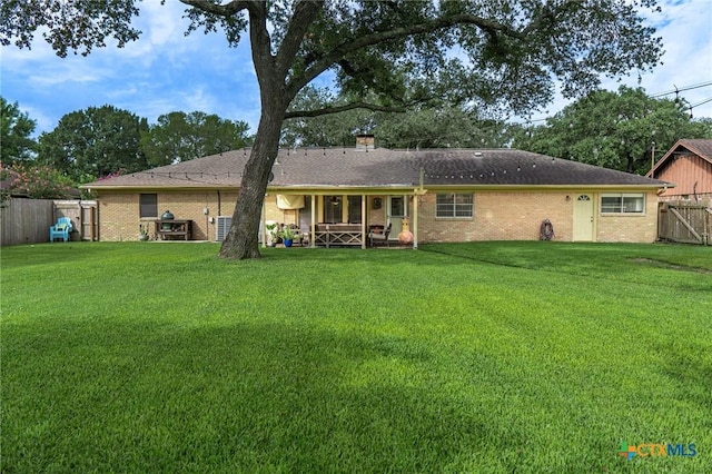 401 Hampshire St, Victoria, TX 77904 - back of house featuring brick siding, a chimney, and covered porch