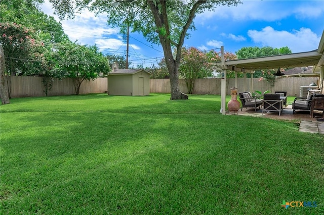 401 Hampshire St, Victoria, TX 77904 - fenced backyard featuring a patio area and a shed