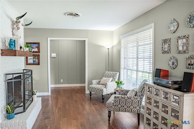 401 Hampshire St, Victoria, TX 77904 - sitting room with wood finished floors and a brick fireplace