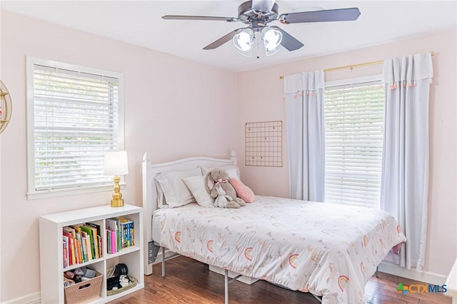 401 Hampshire St, Victoria, TX 77904 - bedroom with multiple windows, wood finished floors, and a ceiling fan
