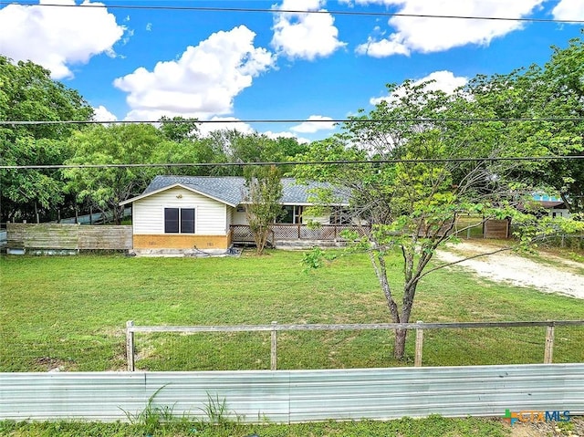 1210 Old Martindale Rd, San Marcos, TX 78666 - exterior space with fence and a front yard