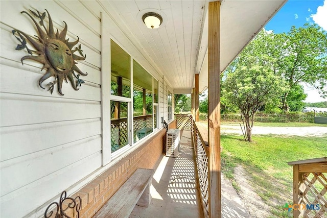 1210 Old Martindale Rd, San Marcos, TX 78666 - view of patio featuring covered porch and ac unit
