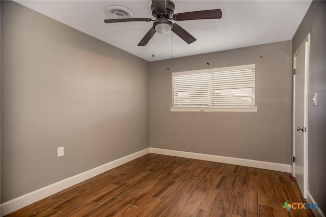 248 Park Rd, Port Lavaca, TX 77979 - unfurnished room with dark wood-style flooring, baseboards, and ceiling fan