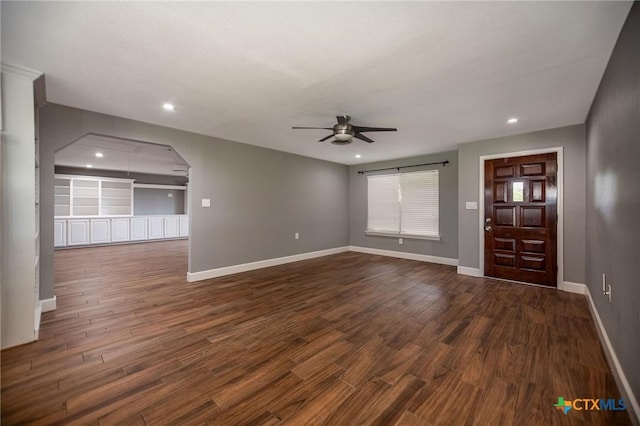 248 Park Rd, Port Lavaca, TX 77979 - unfurnished living room featuring ceiling fan, dark wood-type flooring, baseboards, and recessed lighting