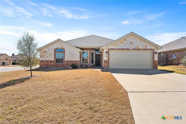 single story home featuring concrete driveway, brick siding, an attached garage, and stone siding