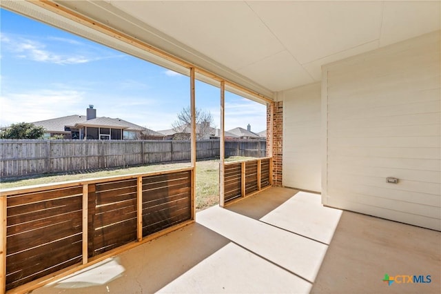 view of patio with a residential view and a fenced backyard